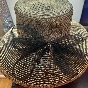 August Hats brand black and gold weave hat